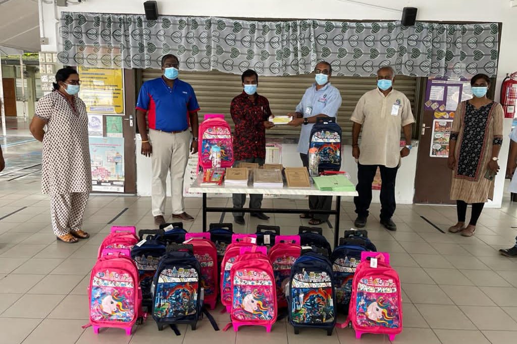 Penang Hindu Association representatives donate school supplies to a primary school. – Pic courtesy of Penang Hindu Association, March 25, 2021