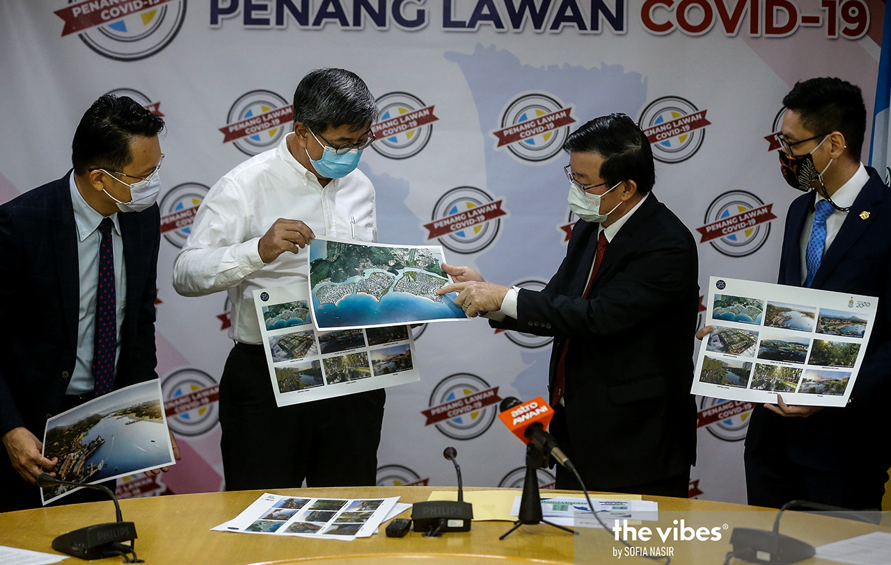 Penang Chief Minister Chow Kon Yeow pointing at a proposed picture of Island A, the biggest of the three islands in the Penang South Reclamation project. – SOFIA NASIR/The Vibes pic, March 25, 2021