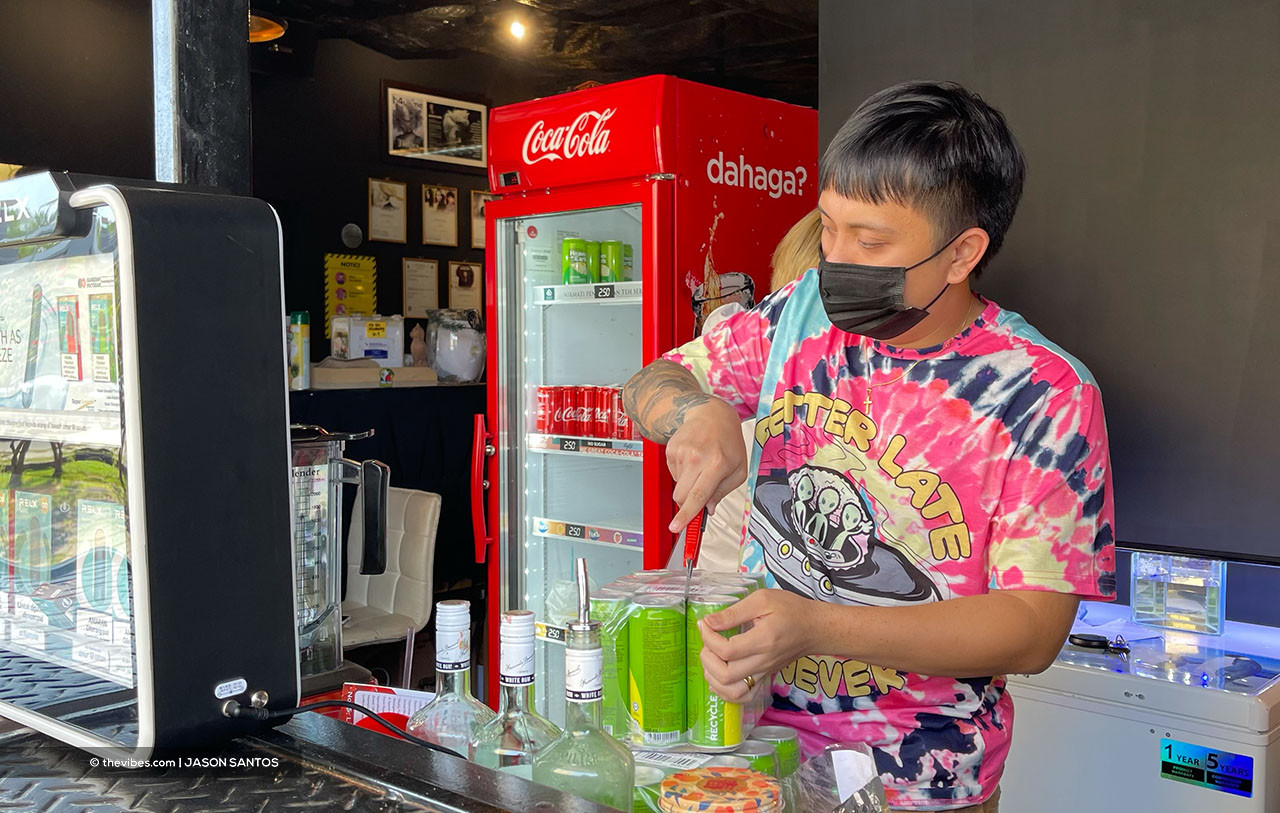 A worker opening a pack of soft drinks at cafe in Kota Kinabalu. Tens of thousands of Sabah youth make up the bulk of the unemployed in the state. – JASON SANTOS/The Vibes pic, April 7, 2021