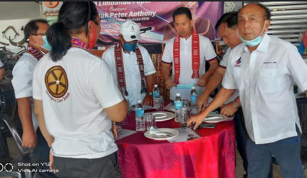 Datuk Peter Anthony (third, right) seemingly breaking his self-isolation orders at an event yesterday.  – The Vibes pic, April 24, 2021