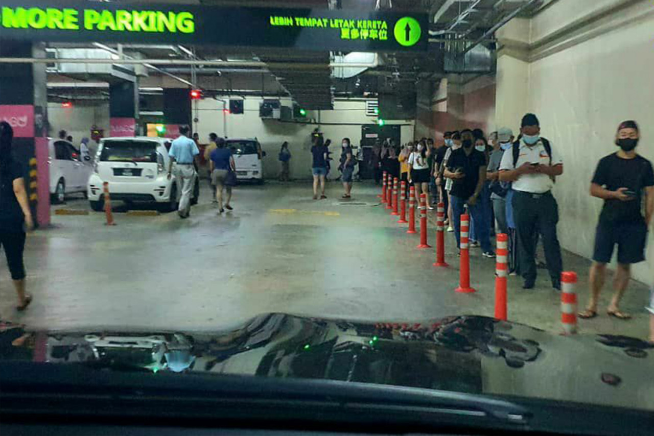 A long queue grew outside Imago shopping mall in Kota Kinabalu from 10am. – REBECCA CHONG/The Vibes pic, May 9, 2021
