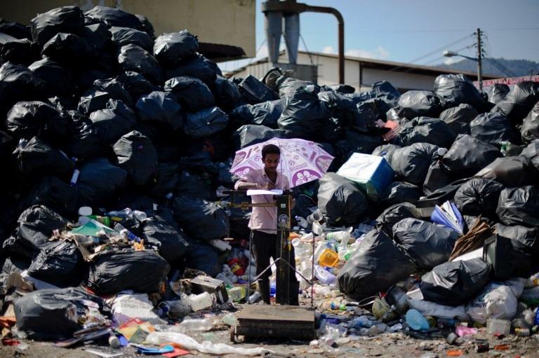 Storing recycled waste for long periods will eventually pose a fire hazard and lead to contaminated air, threatening human health and lives. – AFP pic, July 10, 2021