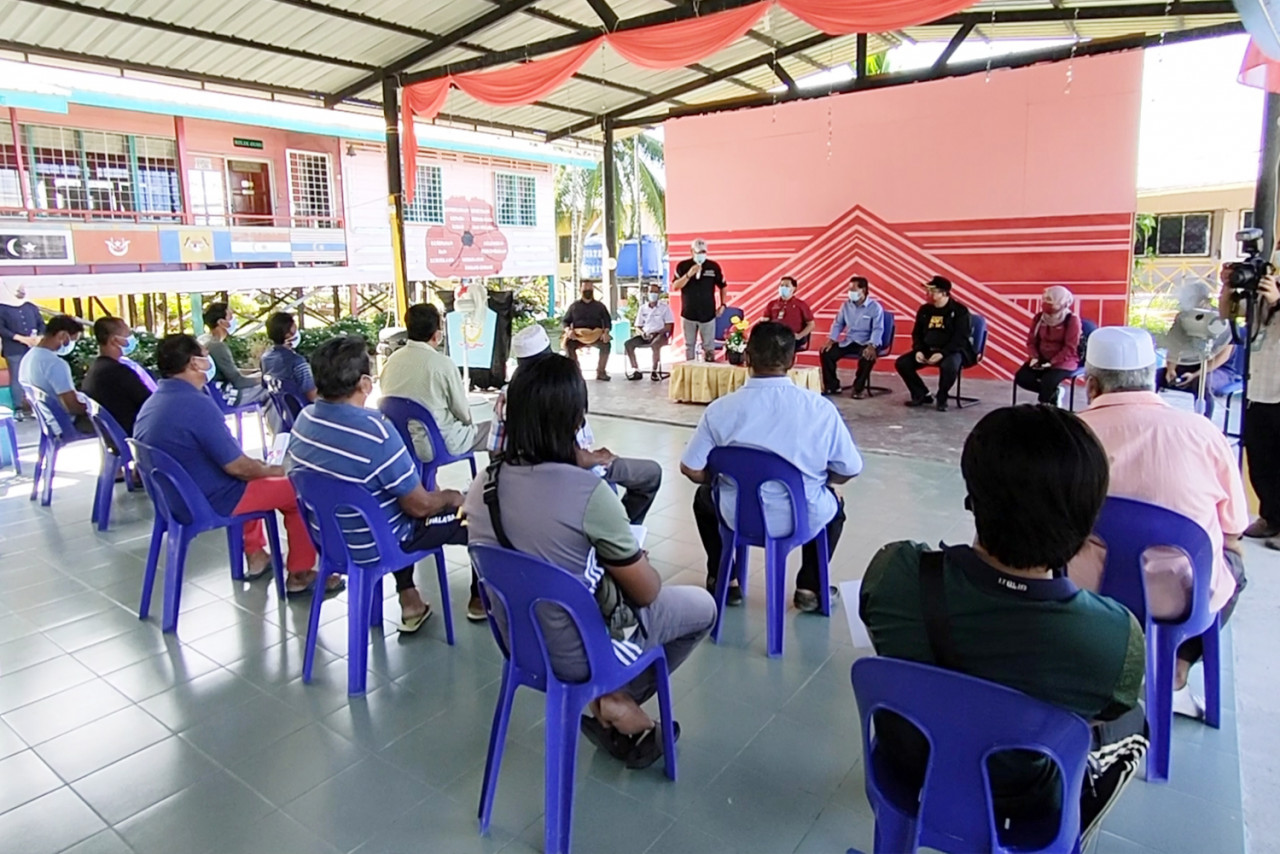 Villagers listening to an explanation on the Covid-19 vaccine at SK Pulau Timbang. – The Vibes pic, June 20, 2021