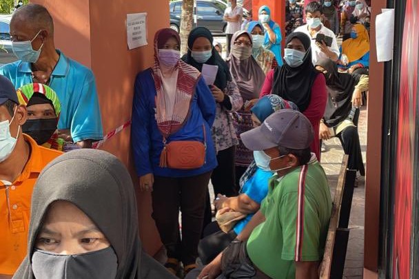 A big crowd gathers in front of Muar MP Syed Saddiq Syed Abdul Rahman’s service centre in Muar, Johor, each day, hoping for assistance. – Syed Saddiq Twitter pic, July 14, 2021
