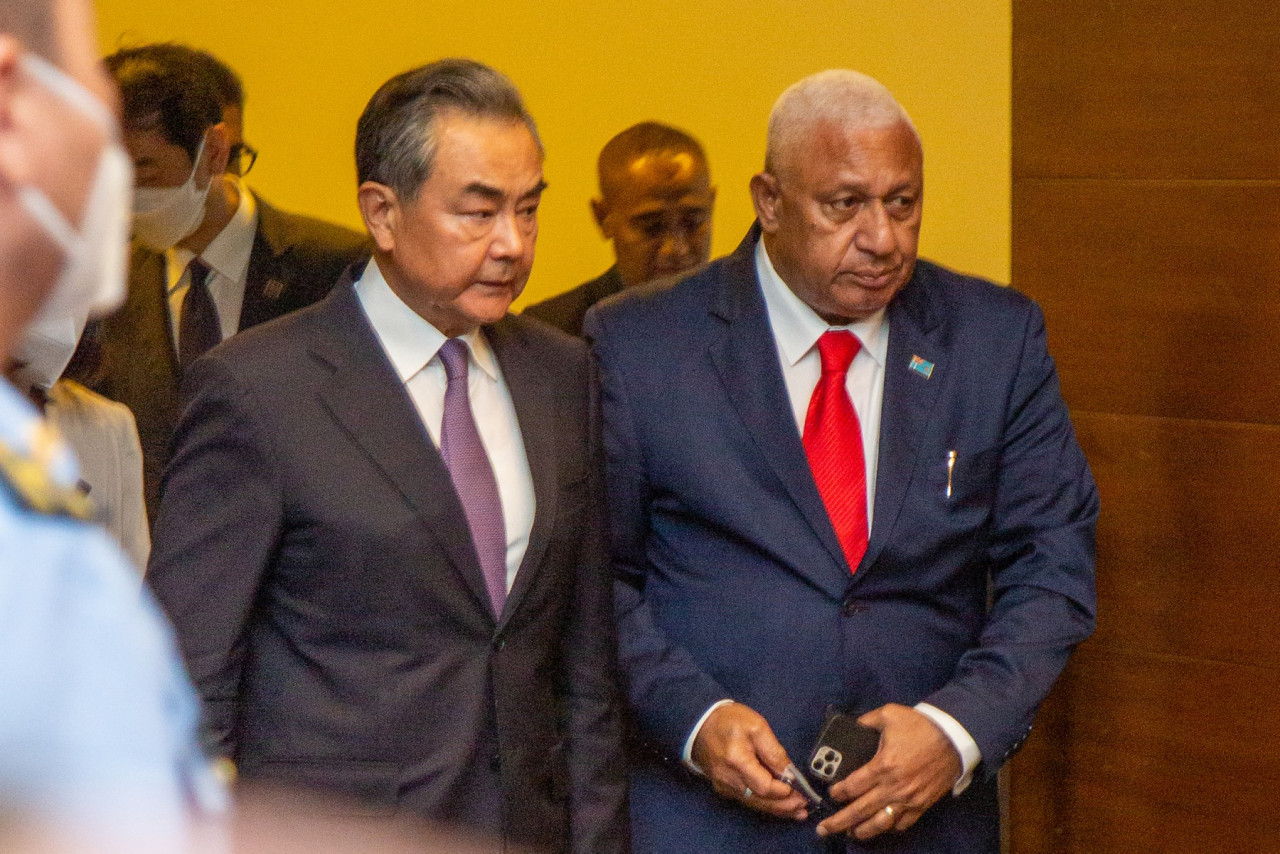 Chinese Foreign Minister Wang Yi and Fijian Prime Minister Frank Bainimarama arrive for a joint press conference in Fiji’s capital city Suva on May 30 this year. At the press conference, Bainimarama pointedly criticised those focused on ‘geopolitical point-scoring’, a swipe at China’s ambitions in the region. – AFP pic, July 11, 2022