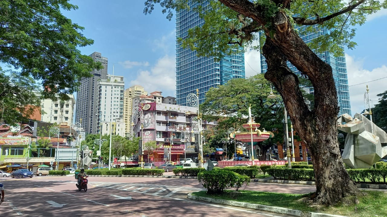 Shady, urban scene featuring well-grown trees, a fountain and sculpture in Brickfields, Kuala Lumpur. – HIMANSHU BHATT/The Vibes pic, June 4, 2022 