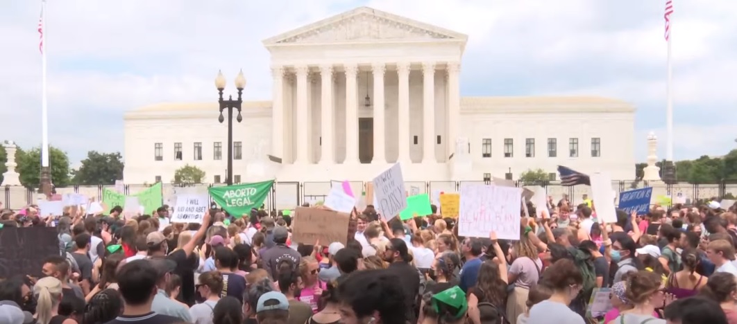 Protests broke out almost immediately in Washington and elsewhere, with dozens of demonstrations under way or planned across the country yesterday evening, according to news reports. – Screen grab, June 25, 2022