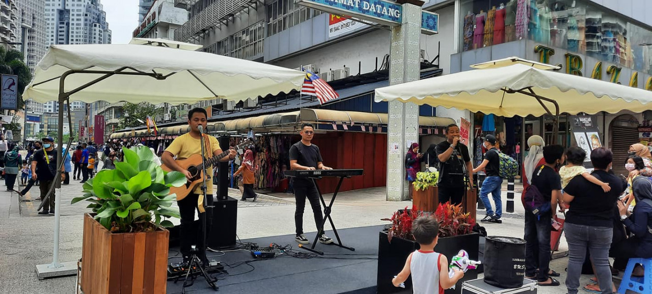 Buskers entertain the pedestrians as they walk through the usually car-busy streets of Jalan Tuanku Abdul Rahman today. – Dewan Bandaraya Kuala Lumpur Facebook pic, August 28, 2022