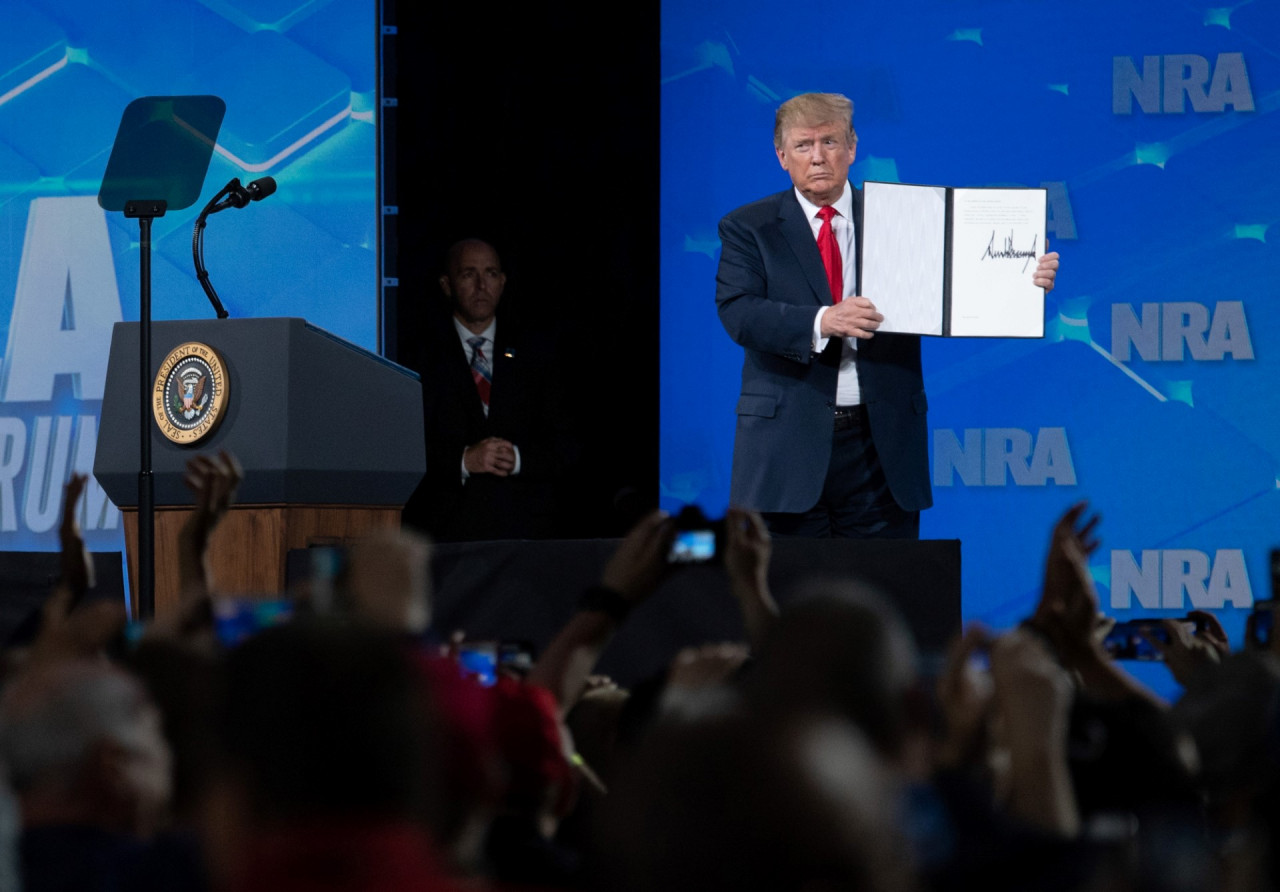 Then US president Donald Trump shows a signed order rejecting the 2013 Arms Trade Treaty as he speaks at the National Rifle Association’s annual meeting at Lucas Oil Stadium in Indianapolis, Indiana, on April 26, 2019. Trump’s administration had decided to proceed with a sale of precision-guided munitions to Saudi Arabia in 2018, which had been put on hold in 2016 by his predecessor Barack Obama. – AFP pic, August 30, 2022