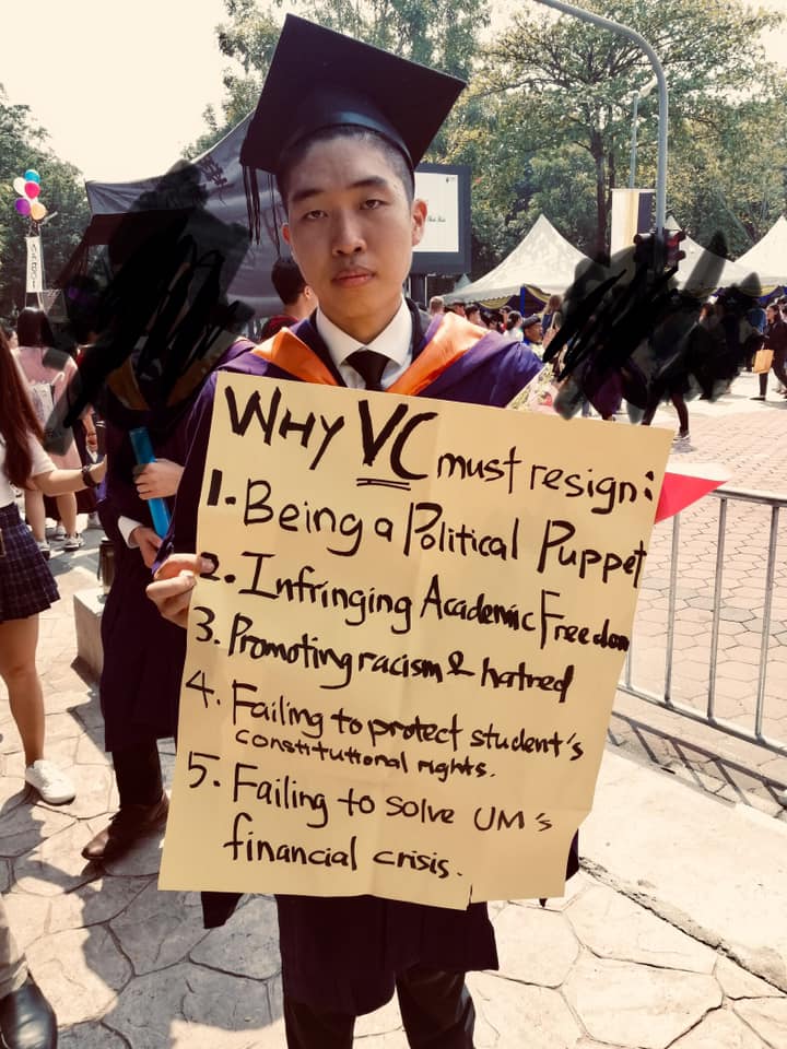 Student activist Wong Yan Ke poses with a placard highlighting the reasons why he wanted the Universiti Malaya vice-chancellor to resign on October 14, 2019. The university had filed a police report against him following his onstage protest during the convocation ceremony. – Wong Yan Ke (黄彦铬) Facebook pic, October 14, 2022