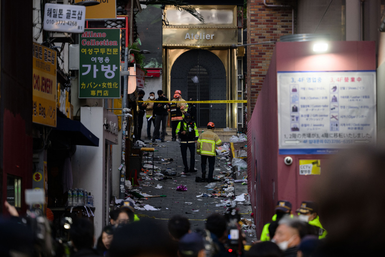Emergency service personnel are seen in the alley where the stampede took place, in the neighbourhood of Itaewon in Seoul. – AFP pic, October 30, 2022 