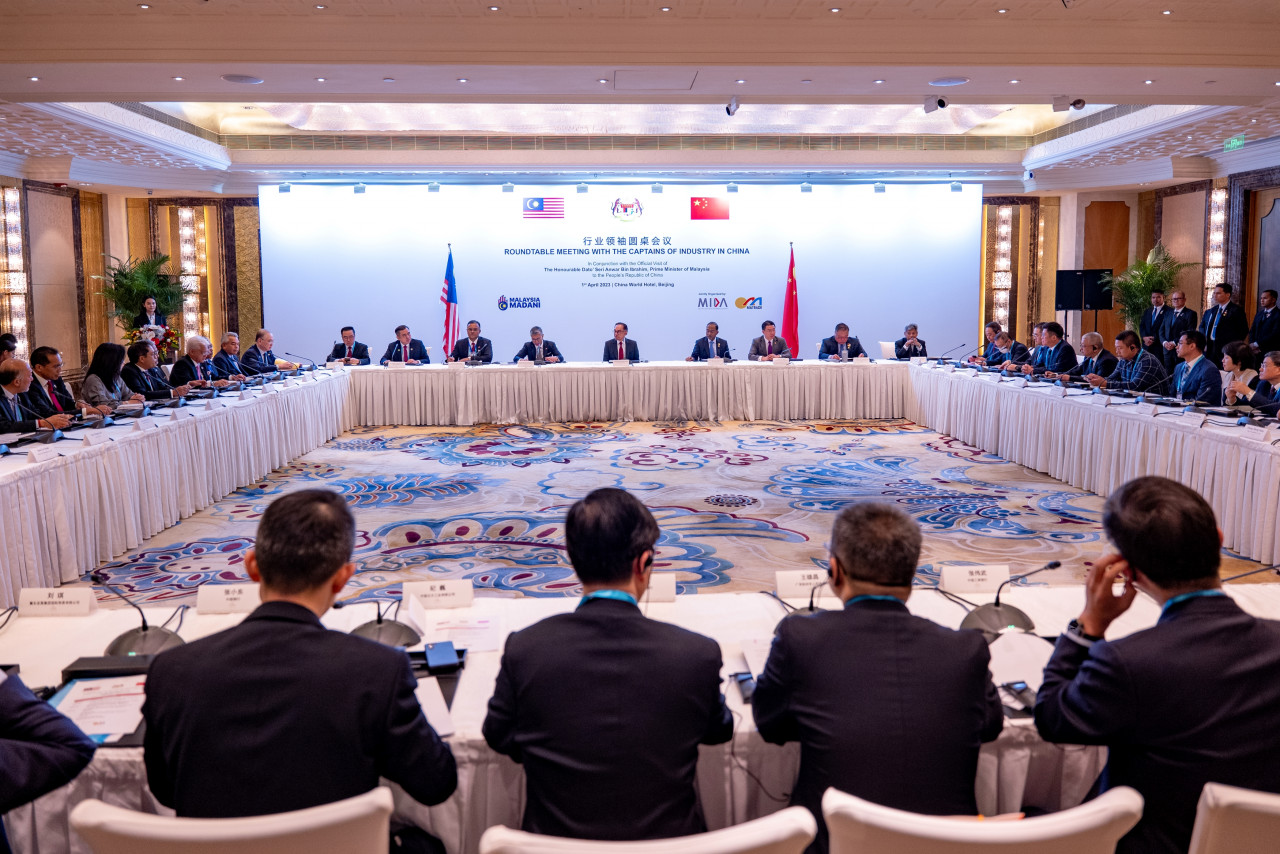Datuk Seri Anwar Ibrahim (back, centre) hosts a round table with elite Chinese business figures in Beijing. It is learnt that it is rare for 50 Chinese tycoons to converge in a single meeting with a leader of a foreign country. – Prime Minister’s Office pic, April 4, 2023