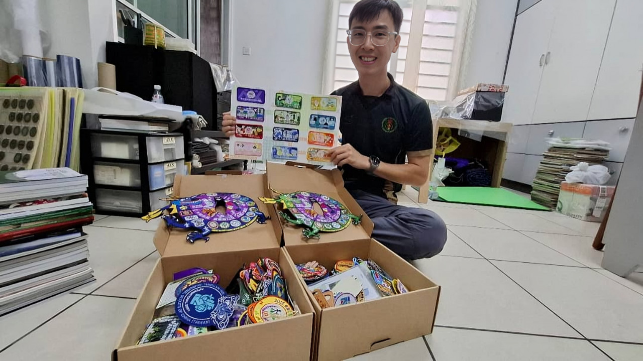 Chan Foo Keong’s son Chan Zen, a king scout, showing the patches he collected during a recent international camp meet. - Jason Santos pic, The Vibes, August 19, 2024. 