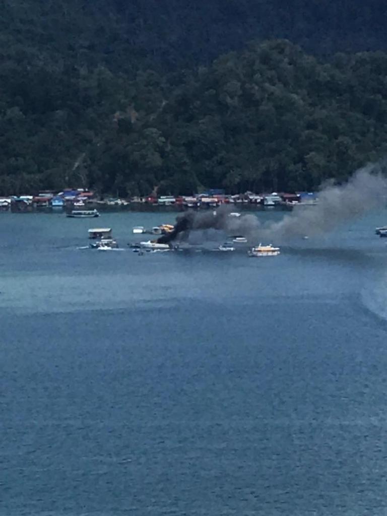 Smoke billowing from the wreckage as Fire and Rescue Department teams attempt to put the flames out. – ESSAM ABDULLAH/The Vibes pic, August 21, 2021