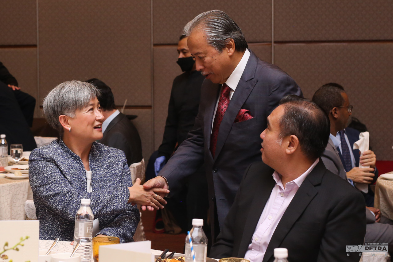 Australian Foreign Minister Penny Wong (left) greets former Malaysian foreign minister Datuk Seri Anifah Aman (centre), next to Seremban MP Anthony Loke. – NOOREEZA HASHIM/The Vibes pic, June 29, 2022