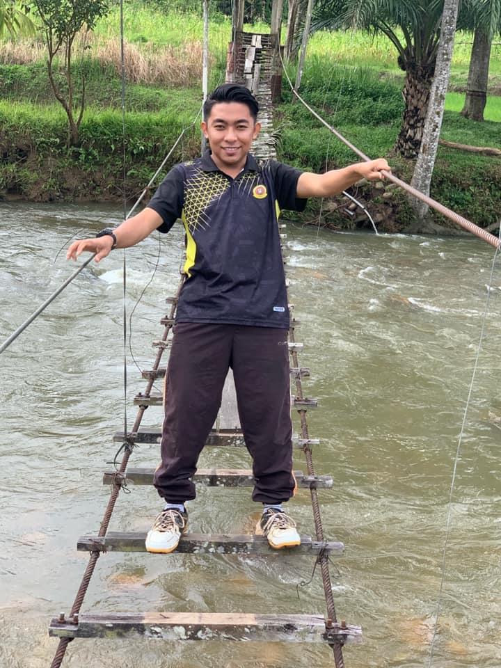 Teacher Muhammad Nazmi has to cross rivers to reach his students. – The Vibes pic, July 23, 2021