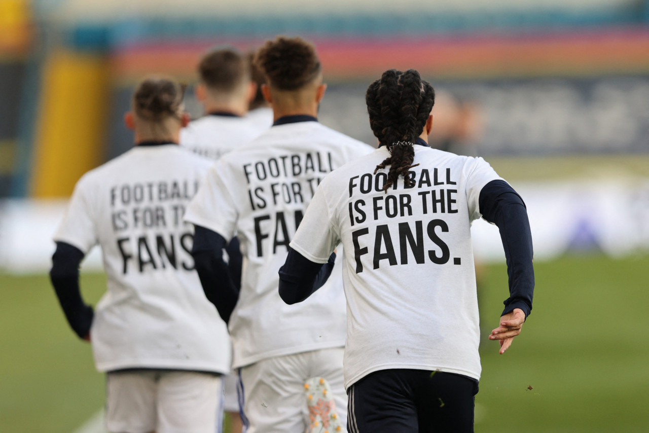 Leeds United players wear T-shirts with slogans against a proposed new European Super League during the warm up for the English Premier League football match. AFP pic