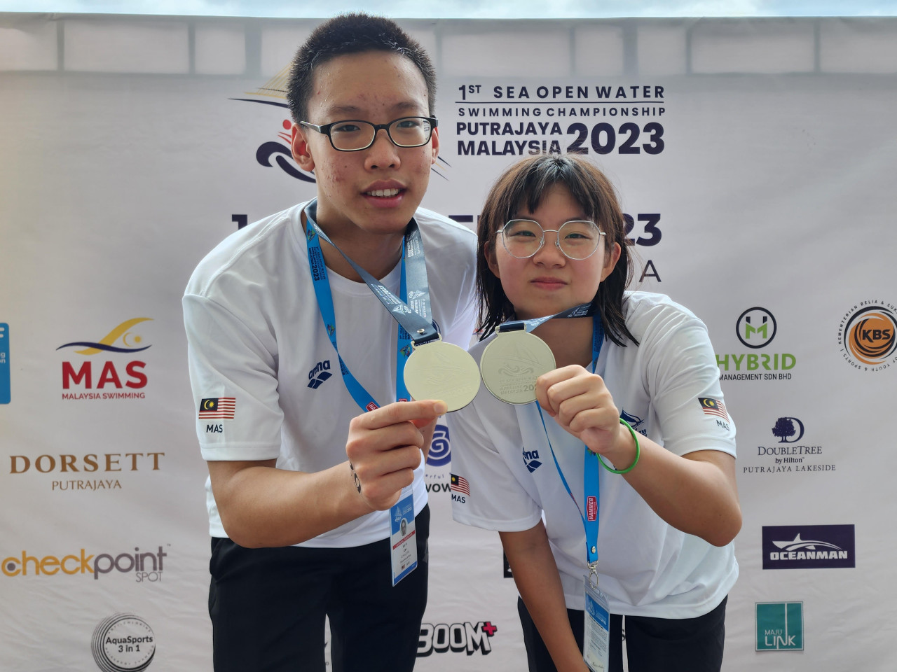 Malaysian Lim Kai Yi (left) finishes as the top male for the country in eighth place with a time of 59m 4.6s, while Magdalene Lau finished as the top Malaysian female in fifth with a time of 1h 3m 48.4s. – Pic courtesy of Hybrid Management Sdn Bhd pic, February 2, 2023