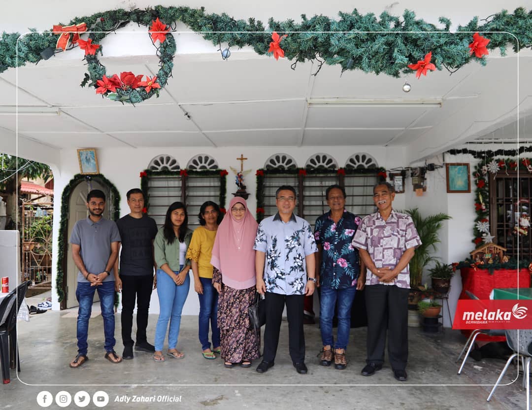 Martin Theseira (far right) pictured with then chief minister Adly Zahari (third from right) and others during Christmas at the Portuguese settlement. – Adly Zahari Facebook pic, November 19, 2021