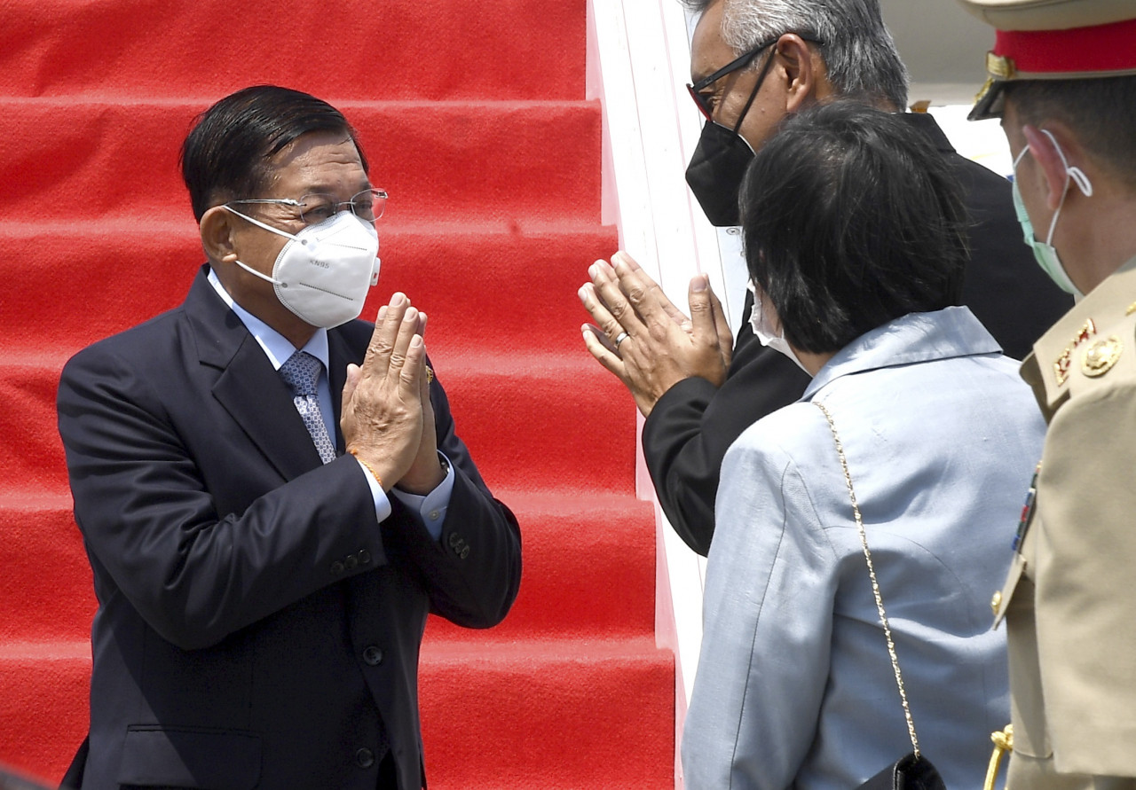 Myanmar’s senior general Min Aung Hlaing (left) being greeted by officials during his arrival at Soekarno-Hatta International Airport in Tangerang, on the outskirts of Jakarta, Indonesia, today. – EPA pic, April 24, 2021