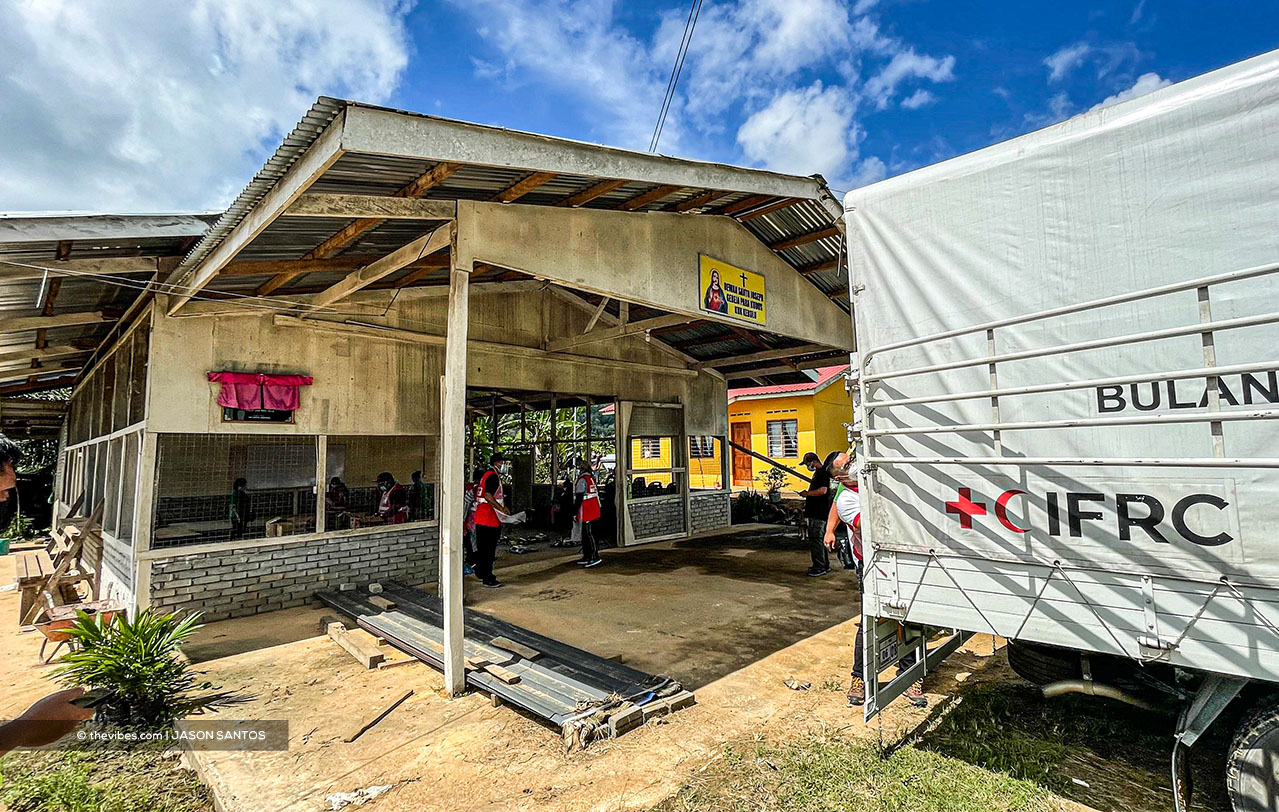 A Red Crescent lorry loaded with food seen outside a community hall in Sook. – The Vibes pic, July 17, 2021