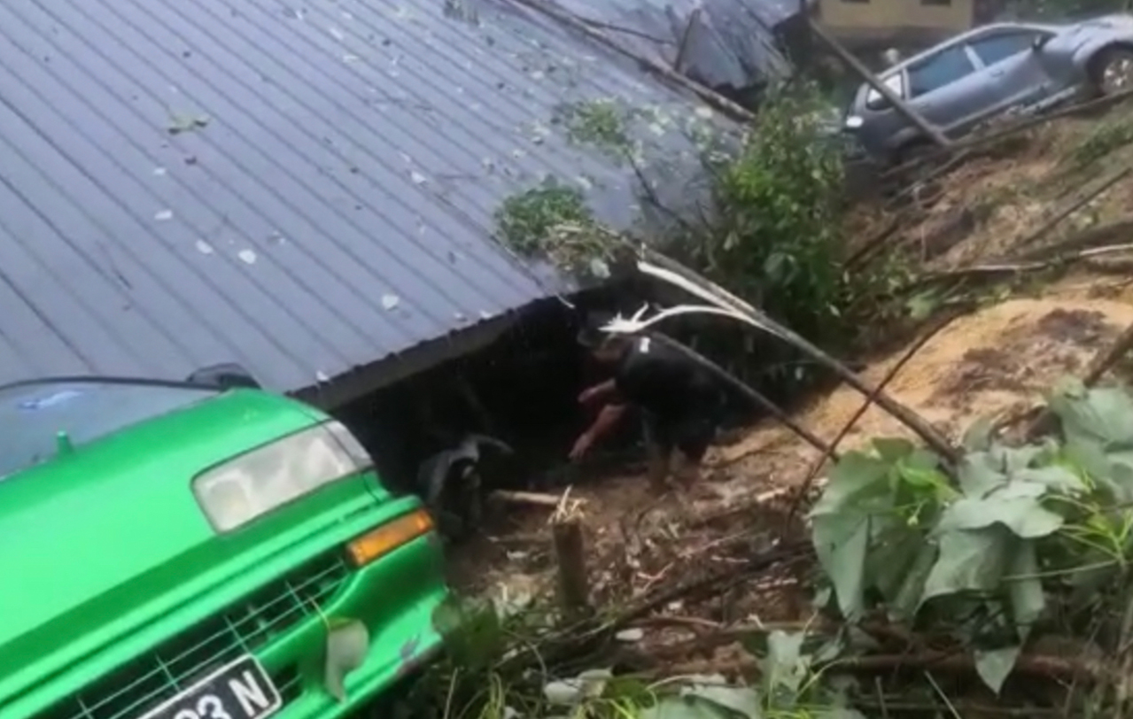 Dorally John’s house engulfed by earth, mud and debris in the landslide yesterday. – Screen grab, September 16, 2021