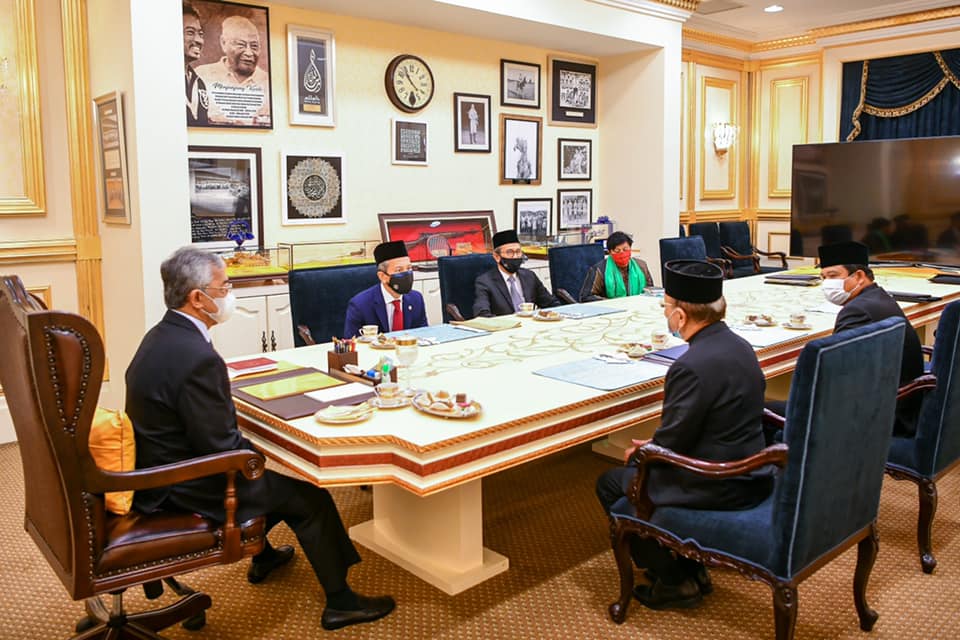 The Agong (left) in his meeting with Dewan Rakyat Speaker Datuk Azhar Azizan Harun (left) and Dewan Negara Speaker Tan Sri Rais Yatim (right) on Tuesday, where they discussed the reopening of Parliament. – Istana Negara Facebook pic, July 1, 2021