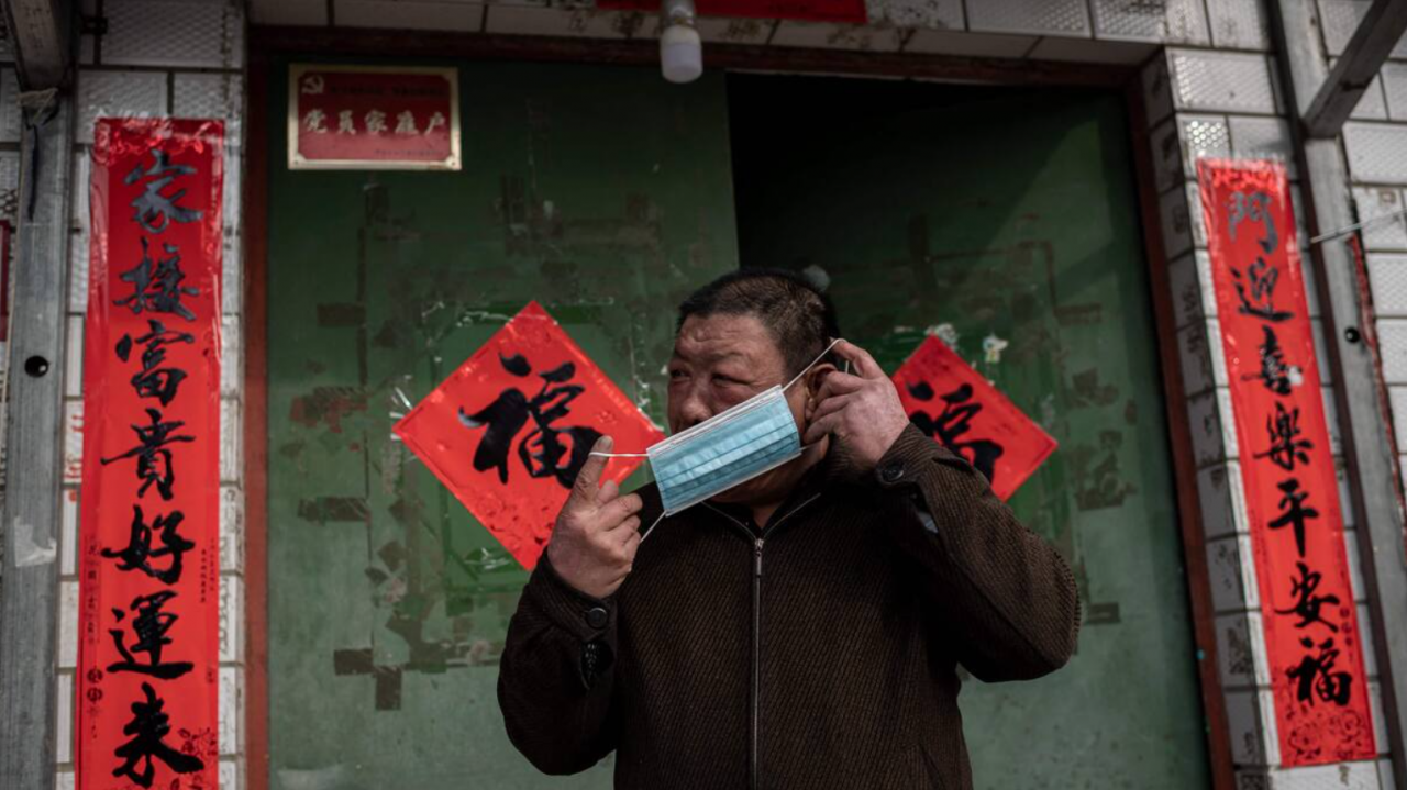 A man in Beijing putting on a mask. At least 4.3 million people have died since the outbreak of Covid-19, including 4,636 fatalities from pandemic reported in China. – AFP pic, August 13, 2021