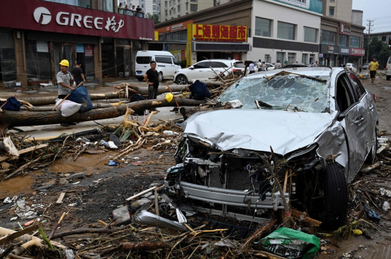 A damaged car after severe flooding and landslide hit Gongyi city, near Zhengzhou, in central China’s Henan. – AFP pic, July 23, 2021