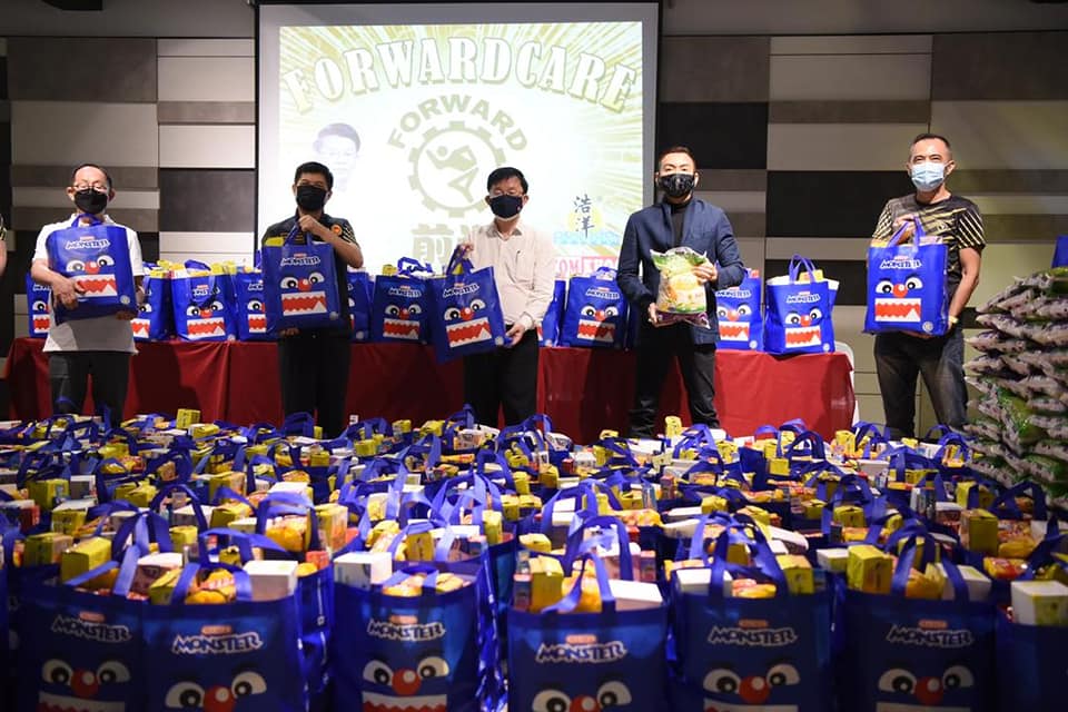 Chow Kon Yeow (centre) with members of the Penang Forward Sports Club, who have launched an initiative to deliver 500 food baskets. – Chow Kon Yeow Facebook pic, July 11, 2021