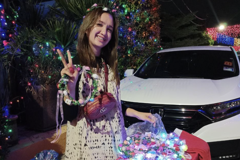 Zilla from Johor Baru says she was here to sell her handmade LED flower crowns, as she could earn well during the festive season. – KIRTIGHA PANNEE SELVAN/The Vibes pic, December 25, 2022