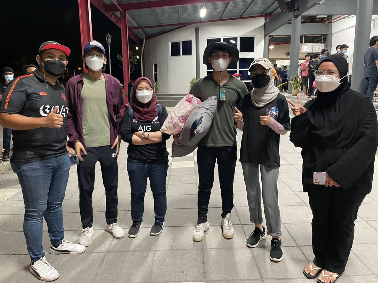 Ezrynn Eddy (second from left) says the situation at the Kg Bestari Jaya village was dire, as some people were forced to consume expired food while waiting for help. – Pic courtesy of Ezrynn Eddy, December 24, 2021 