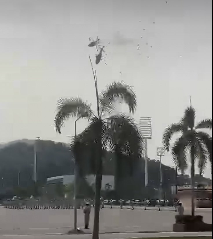 In a video posted on Mohd Helmi's Facebook page, which has since been taken down, two of the helicopters are seen crashing into each other before spiralling to the ground. – Screenshot, April 23, 2024.