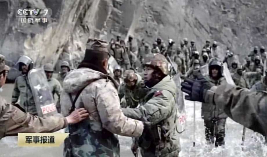 Indian and Chinese troops confronting each other while wading through a river in the barren and ice-covered Karakoram Mountains, carrying sticks and shields. – Screen grab, February 20, 2021