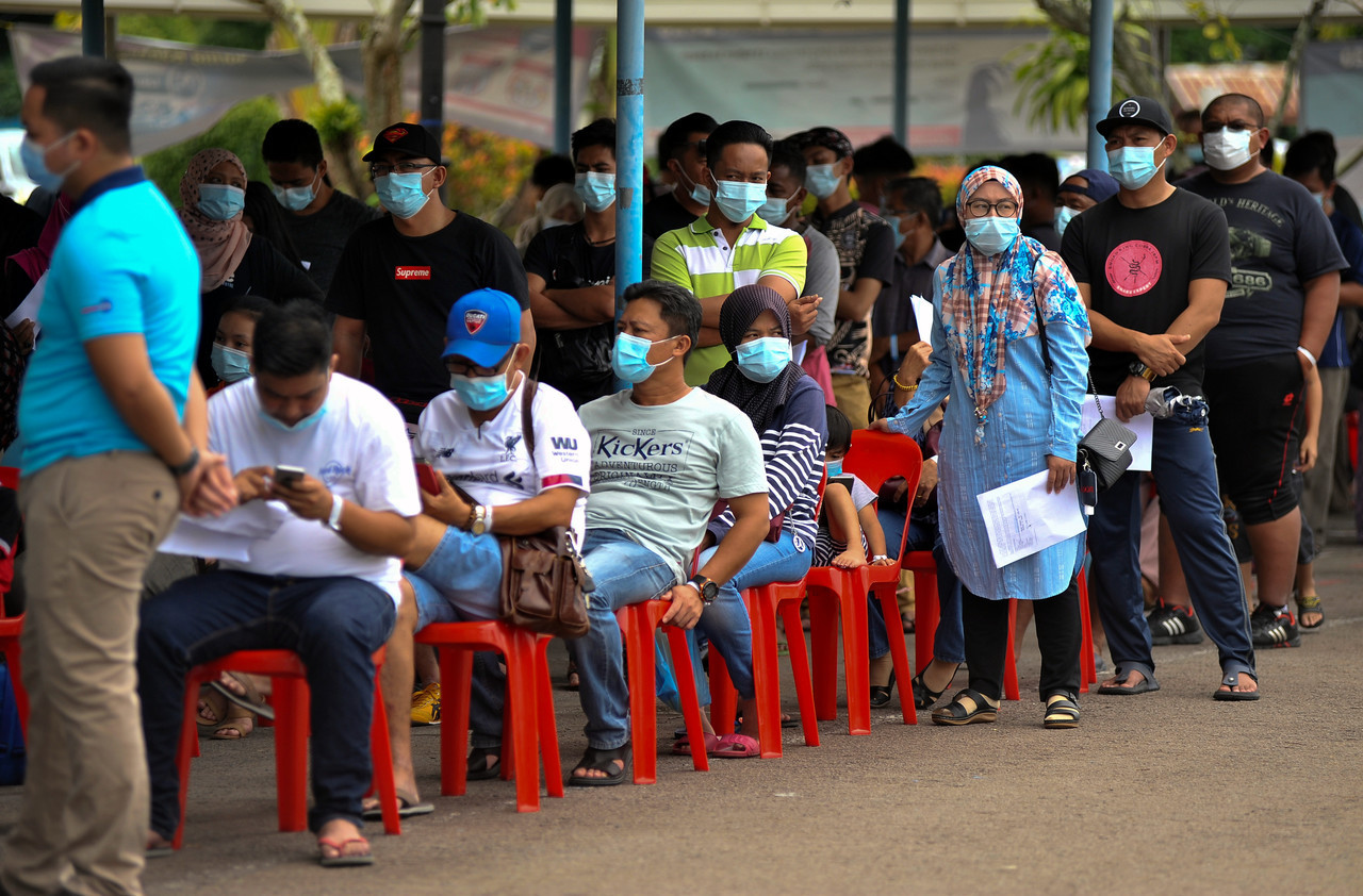 People line up for Covid-19 tests in Labuan in September 2020. There is no doubt the pandemic triggered a massive increase in government debt, mainly in low-income countries, but it would be economically wrong to put all the blame on the pandemic, opine the writers. – Bernama pic, February 25, 2023 