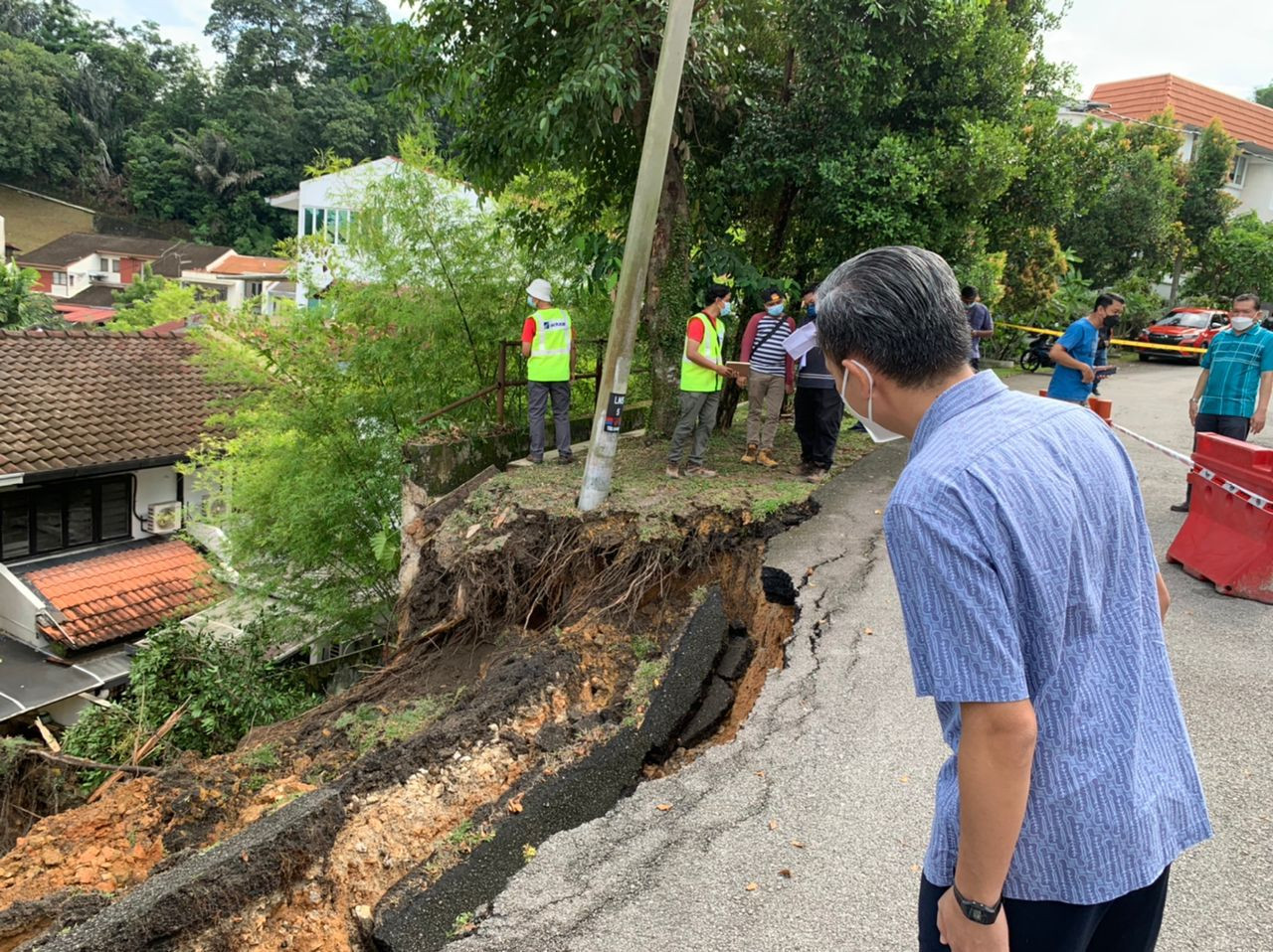 Following heavy rain, soil had given way along Jalan Lingkungan Negri Sembilan and washed down on Jalan Limau Purut. – Pic courtesy of Fahmi Fadzil, October 24, 2021
