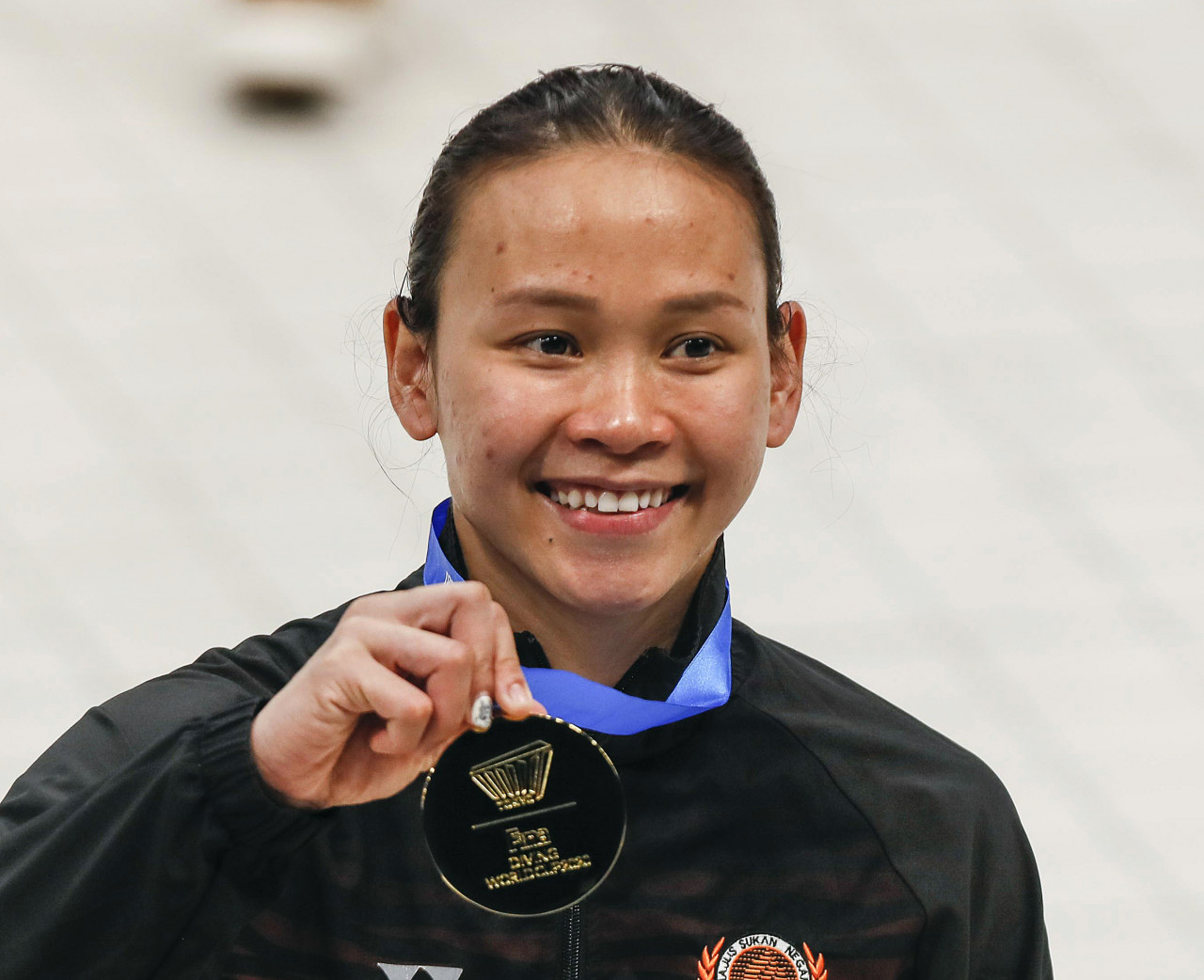 National diver Pandelela Rinong showing the gold medal she won for the women’s 10m platform final of the Diving World Cup 2021 in Tokyo, Japan earlier this week. – EPA pic, May 8, 2021