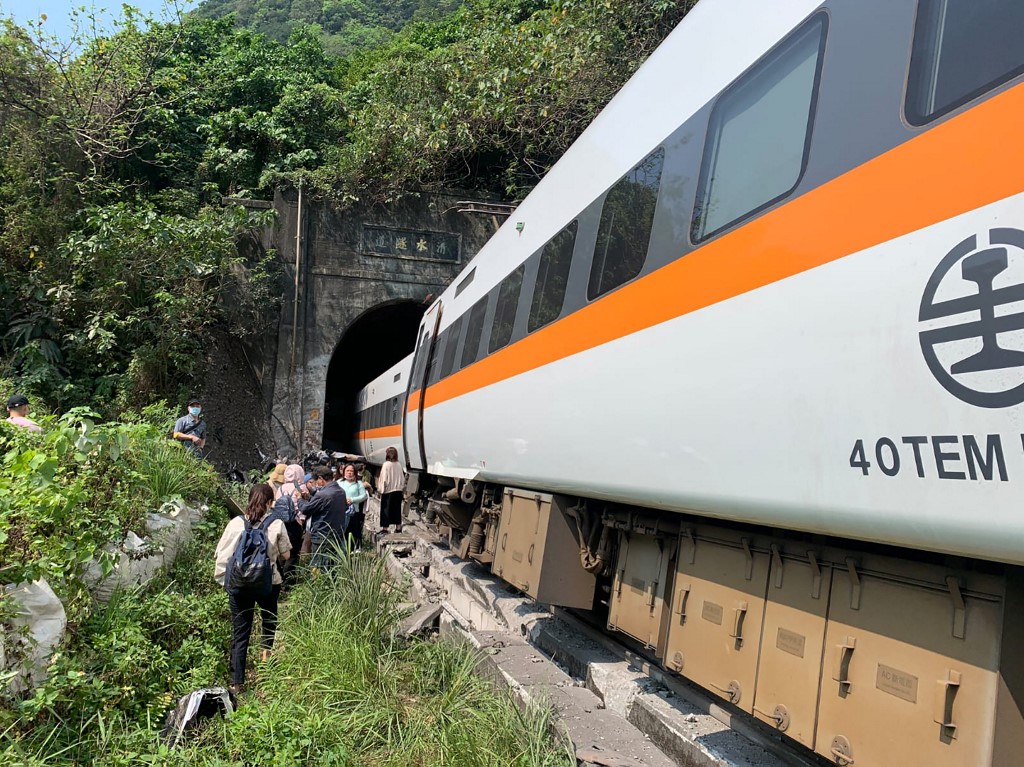 People further back in the train were able to walk away from the crash comparatively unscathed. – AFP pic, April 2, 2021