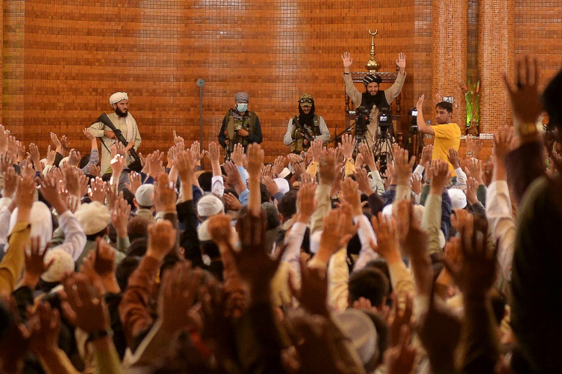 Armed Taliban fighters standing next to an Imam during Friday prayers at the Abdul Rahman Mosque in Kabul yesterday, following the Taliban’s stunning takeover of Afghanistan. – AFP pic, August 21, 2021