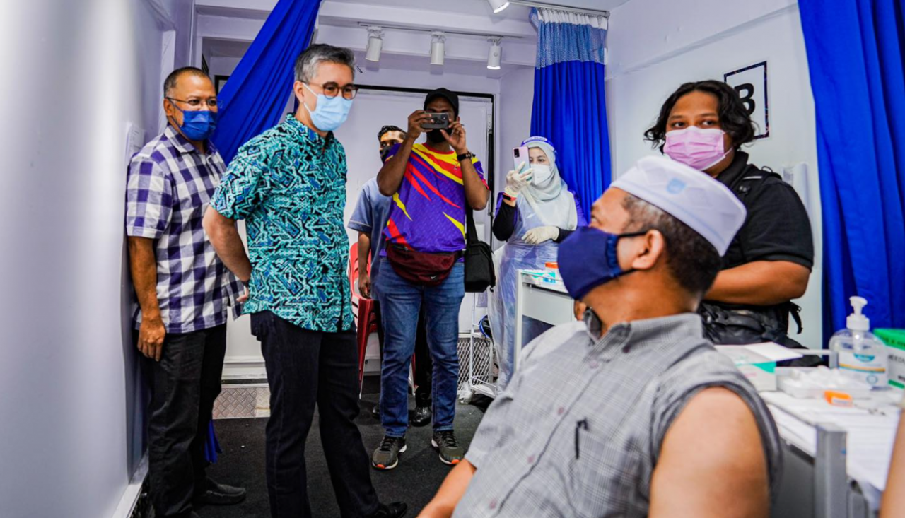 Datuk Seri Tengku Zafrul Tengku Abdul Aziz (second from left) says Covid-19 hospitalisations became manageable in Labuan and Sarawak after both fully vaccinated 50% of their adults. – Tengku Zafrul Tengku Abdul Aziz Facebook pic, August 7, 2021