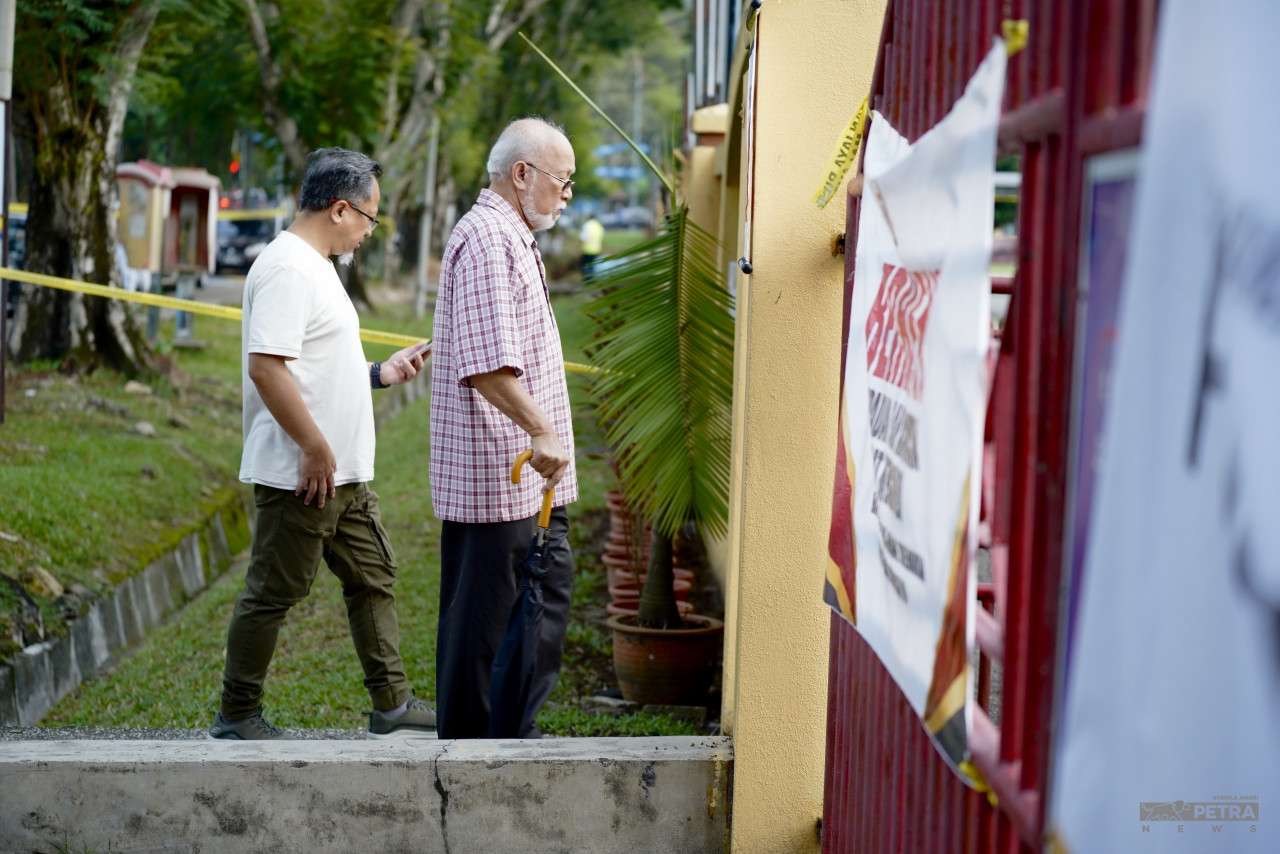 Voters entering the polling centre at SMK Taman Melawati. – SYADILA AMARI/The Vibes pic, August 12, 2023