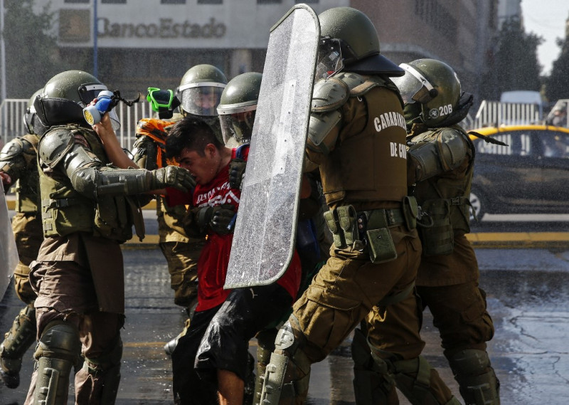 Hundreds protest in Santiago against Chilean president