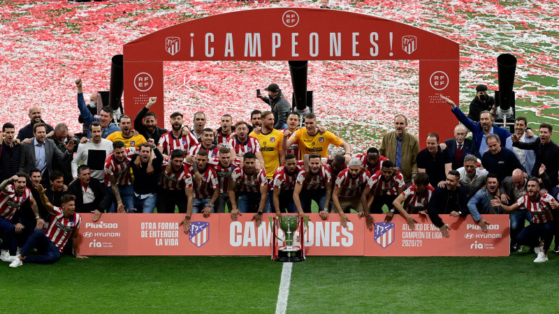 'Man of character' Suarez leads Atletico to La Liga as Real fall short