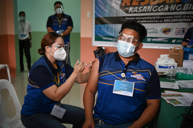 Vaccine roll-out starts in Philippines as public confidence falters