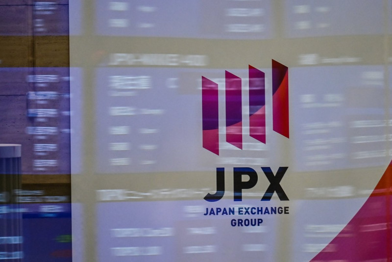 Tokyo stocks end higher as investors study massive US stimulus