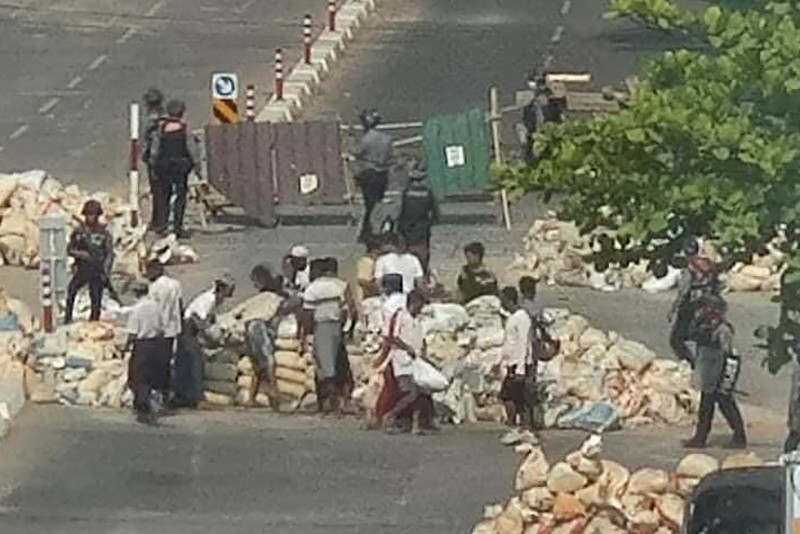 Myanmar army forces civilians to dismantle barricades by gunpoint