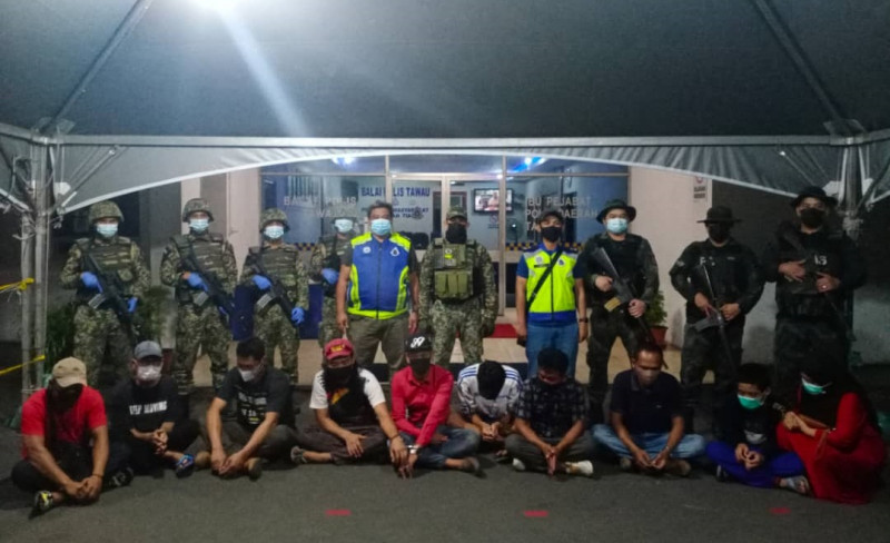 2 locals among migrants held in Sabah human-trafficking op