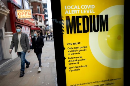 Half of England now under tougher virus restrictions