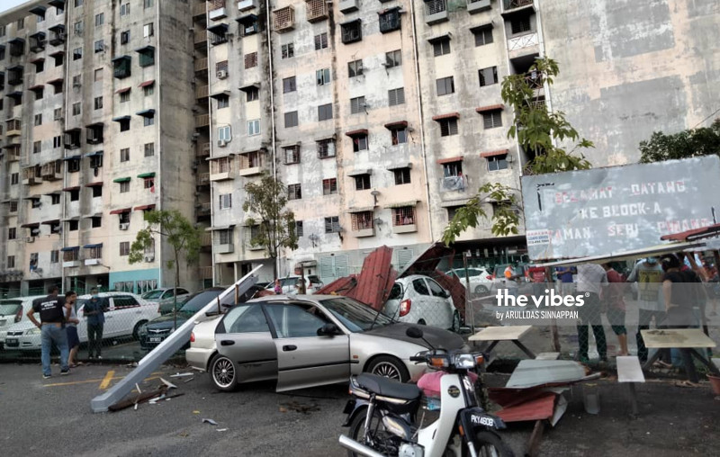 Strong winds tear roof off Penang flats, cars damaged
