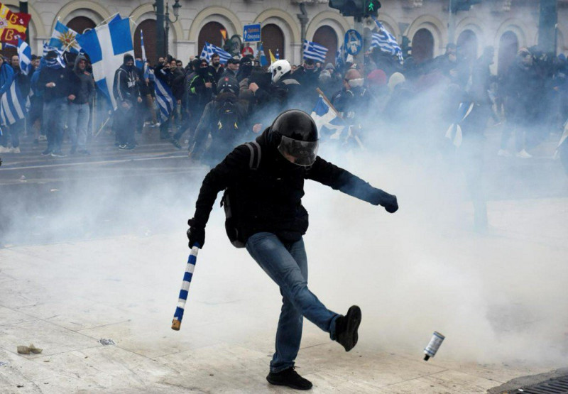 Greek government vows to use less tear gas